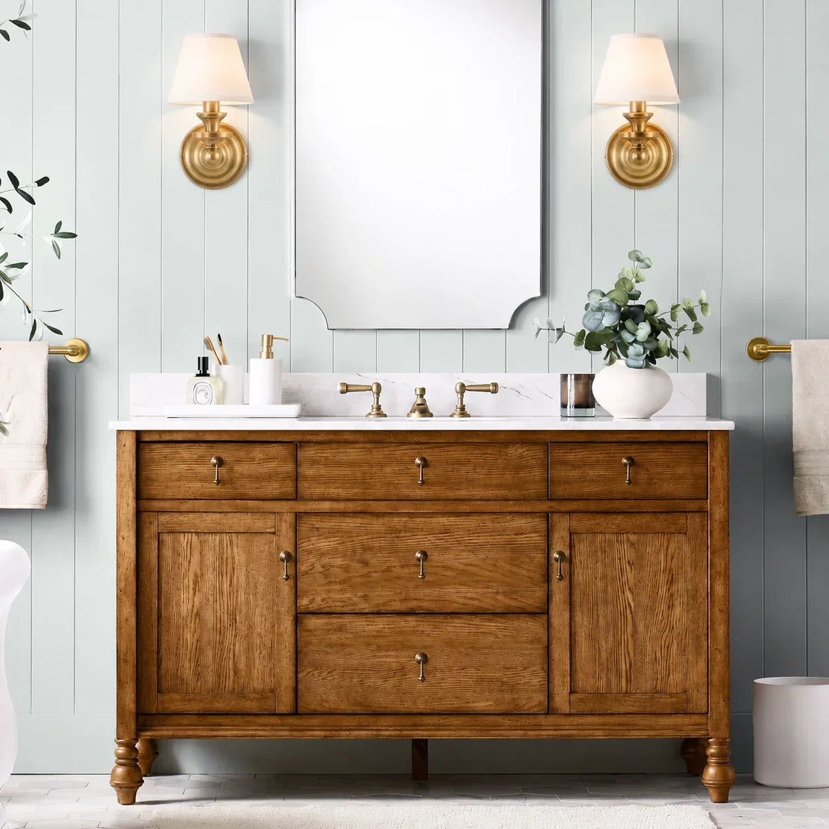 Brass-finished metal wall sconce