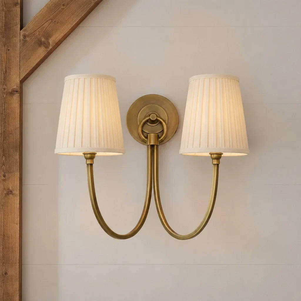 Metal arm linen wall sconce