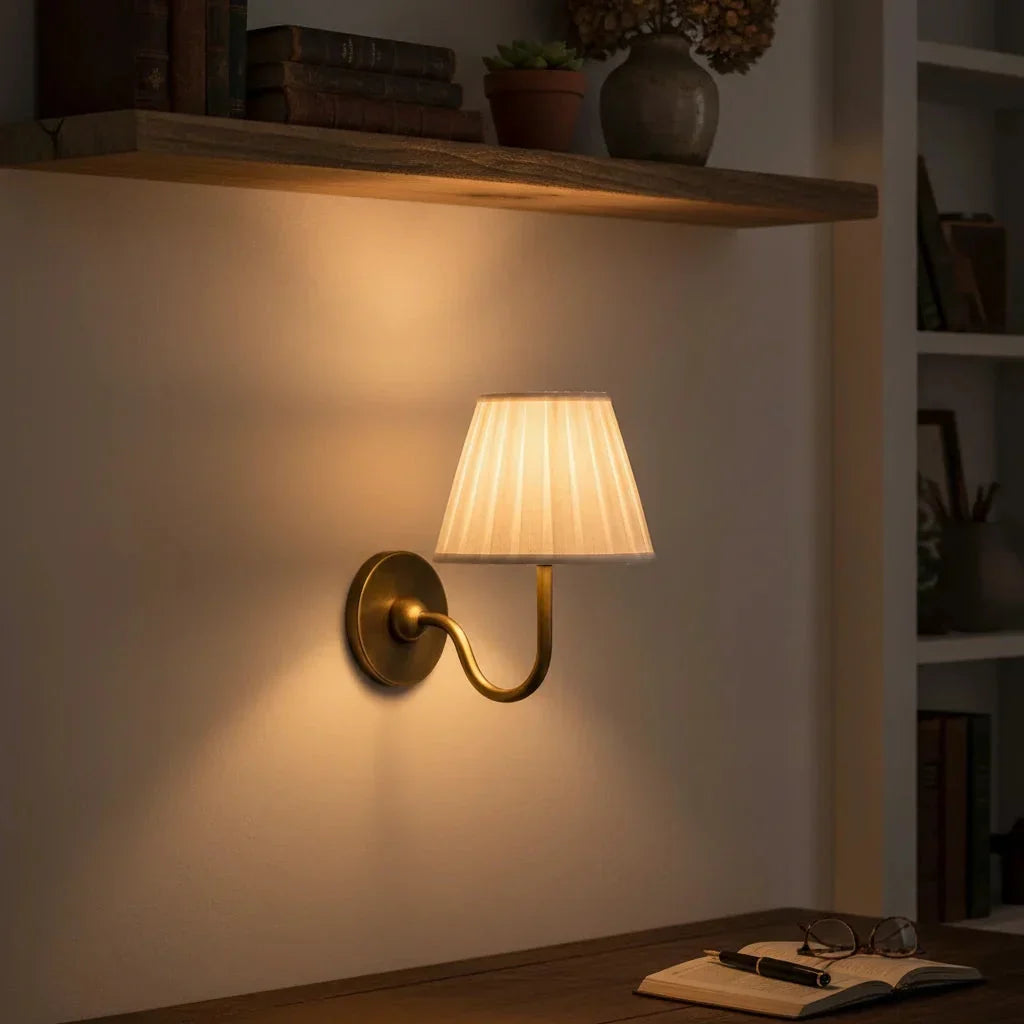 Wall sconce with pleated shade