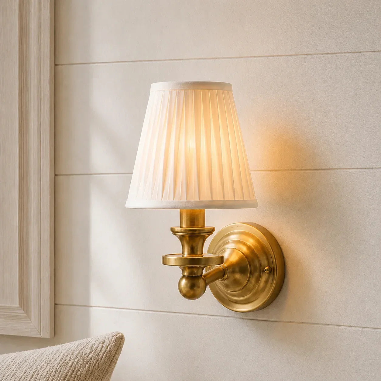 Brass wall sconce with ambient lighting