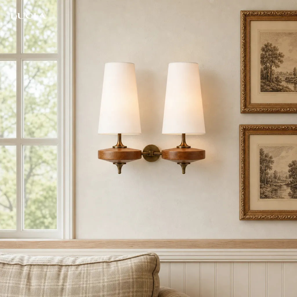 Fabric wall sconce with ambient lighting