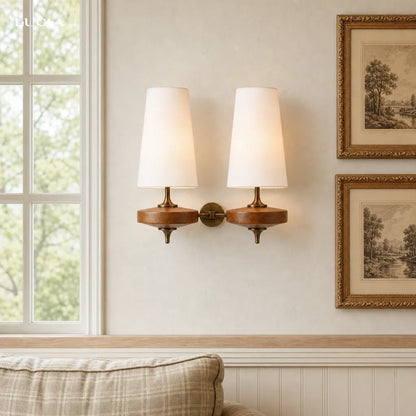 Fabric wall sconce with ambient lighting