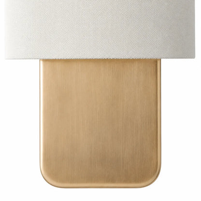 Linen wall sconce with ambient lighting
