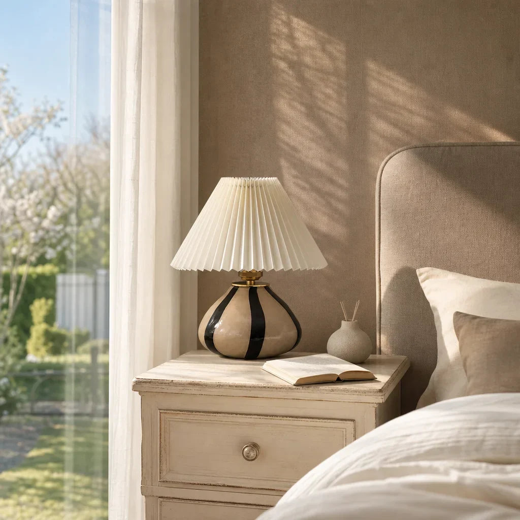Pleated fabric lamp with ambient lighting