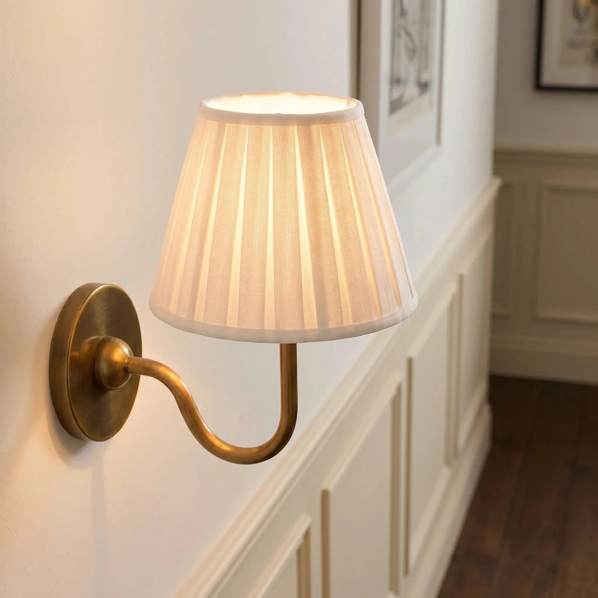 Pleated wall light with ambient lighting