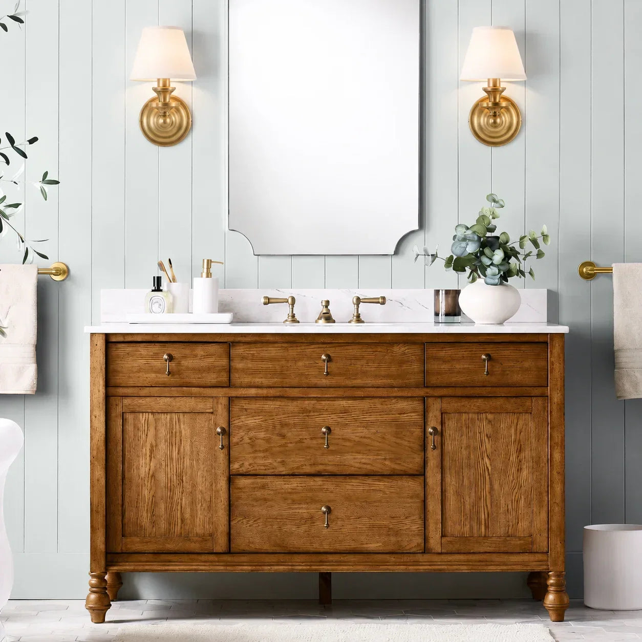 Brass-finished metal wall sconce