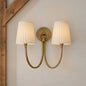 Metal arm linen wall sconce