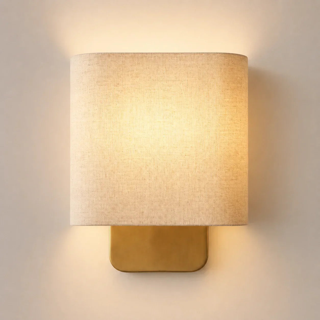 Metal wall sconce with linen shade